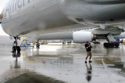 MIA Airfield Tour - Steven DeLisser shooting under American Airlines B777-323(ER) to stay out of the rain