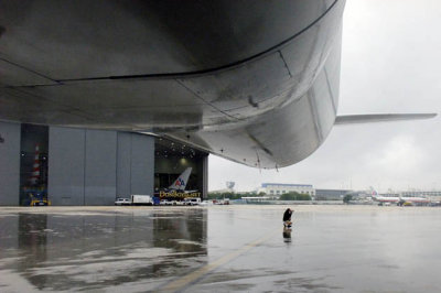 MIA Airfield Tour - Canadian photographer Steven DeLisser shooting from under the tail of AA B777-323(ER) N730AN