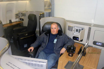 MIA Airfield Tour - Matt Coleman sitting in the first class section of American Airlines B777-323(ER) N730AN
