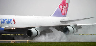 MIA Airfield Tour - China Airlines Cargo B747-409F(SCD) B-18722 reversing thrust in the rain on runway 27 at MIA