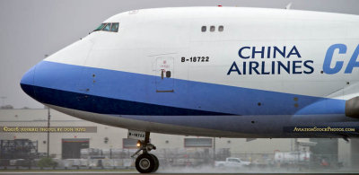 MIA Airfield Tour - China Airlines Cargo B747-409F(SCD) B-18722 rolling out after landing in the rain on runway 27 at MIA
