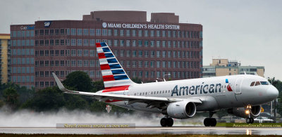 MIA Airfield Tour - American Airlines Airbus A319-112 N5007E rotating from runway 27 in the rain