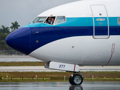 MIA Ramp Tour - friendly captain of new Eastern Airlines B737-8CX N277EA waving to photographers while taxiing to the terminal