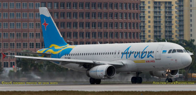 MIA Airfield Tour - Aruba Airlines Airbus A-320 P4-AAA on takeoff roll on runway 27 at MIA