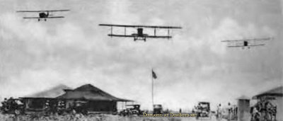 1918 - three U. S. Marine Corps aircraft flying over aviators and support staff at Marine Flying Field Miami