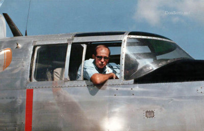 1985 - Senior Agent Clair Sherrick in the cockpit of a North American B-25 Mitchell bomber at Miami International Airport