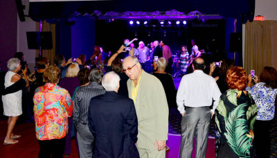 HHS-66 50-Year Reunion and Reunion of the 60's:  dancers in foreground and classmates singing on stage in the background