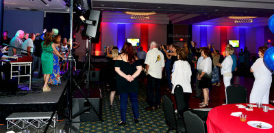 HHS-66 50-Year Reunion and Reunion of the 60's: classmates watching classmates singing and dancing on stage with the band