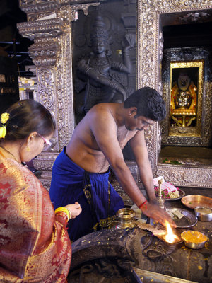 Devotee offering Puja, Kudroli Gokarnath Temple, Mangalore, India.