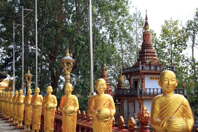Lineup of Buddhas, Wat Krom, Sihanoukville, Cambodia.