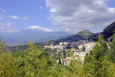 Panorama of Castelmola and Mt. Etna, from Teatro Greco, Taormina, Sicily, Italy.