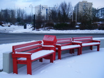 Red benches in winter