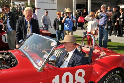 Racing legend and concours judge Bob Bondurant checks out the 1965 Cobra, CSX3035, represented by Wayne Carini, left (0134)