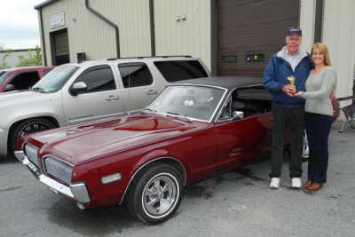 Allison Griffiths, owner of Treasured Motorcars, with Louis Franck, left, and his People's Choice 1968 Mercury Cougar. (0638)