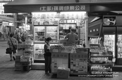 A stand that sells beverages and ink stamps