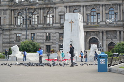 Tourists Feeding The Pigeons