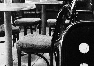 empty chairs at empty tables tables