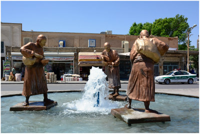 statues of water sellers in the fountain at Yazd's main square
