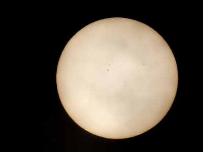 Sun through heavy clouds - sunspots visible