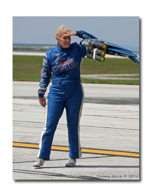 Julie Clark inspecting the pyrotechnics install on her T-34 wing tip 