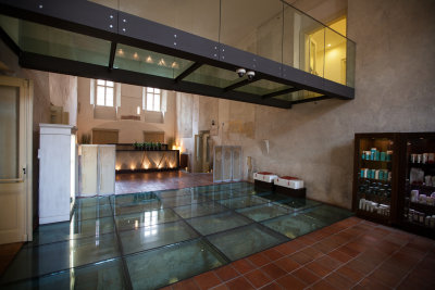 Spa with relics under glass floor.