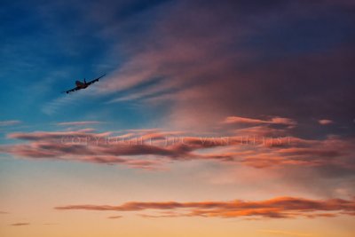 747-400 departing at sunset