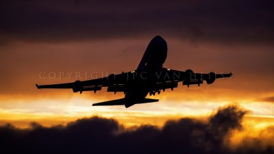 UPS 747-400 taking off into the sunset
