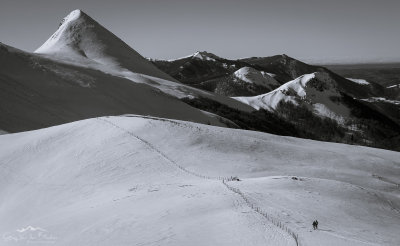 Tour skiers beneath the Puy Griou (left) and Le Griounou (right)