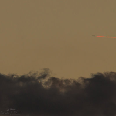 Venus in the clouds and airplane in flames