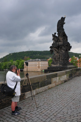 Heavily armed photographer