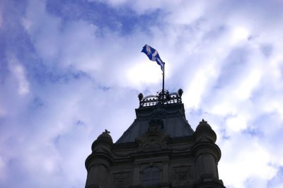 Quebec Flag On Top Parliament Building.jpg