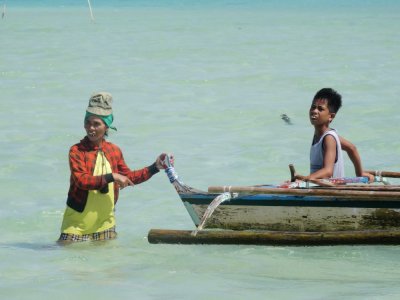 Local Conch and Seashell Seller and Child (3).jpg