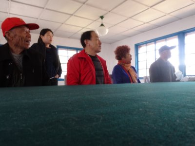 Chinese Tourists at Signing Table - Armistice Talks Hall - Panmunjom DMZ.jpg