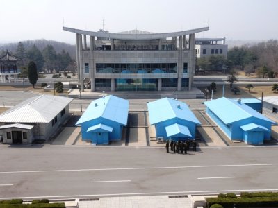 Joint Security Area Looking Towards an Empty South Korean Side at Freedom House - Blue is UNC and White is PLA (NK).jpg