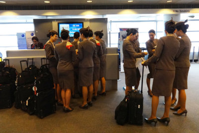Asiana Airlines' flight attendants strive for a similar look with their uniforms & hair.