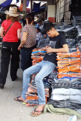  A teenager in the main market doing what teenagers from all over the world  typically do