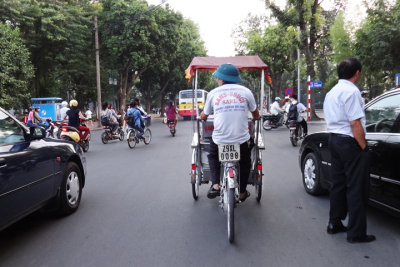 Hanoi's streets typically are busy with cars, various types of cycles and rickshaws  - seen while returning to the Aranya Hotel