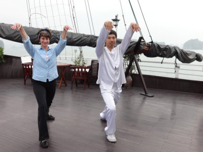 Sally learning T'ai Chi aboard the Treasure Junk in Ha Long Bay, Vietnam