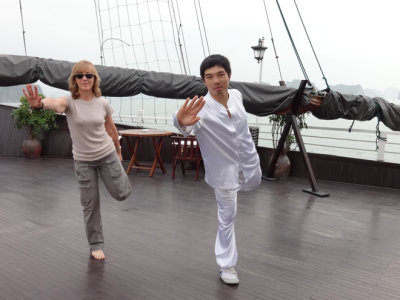 Fran learning T'ai Chi aboard the Treasure Junk in Ha Long Bay, Vietnam