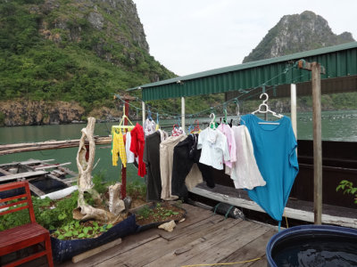 Clothing out to dry at a house in the floating village of Ha Long Bay, Vietnam