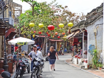 Silk lanterns hanging  across a street in Old Town  - Hoi An, Vietnam 