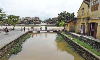The Thu Bon River (background) and a canal (foreground) - Old Town, Hoi An, Vietnam