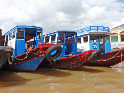 Boats on the My Tho River - used to transport tourists to nearby islands - My Tho, Mekong Delta, Vietnam