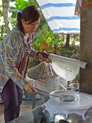 Making rice paper - on an island near My Tho in the Mekong Delta, Vietnam