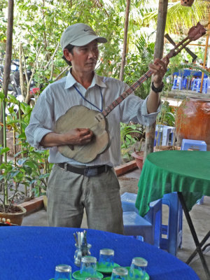 A musician at our tea party - on an island near My Tho in the Mekong Delta, Vietnam