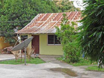 Modest house with a serious satellite dish - within the enclave of the Customs Office - Cambodian/Vietnamese border