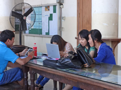 Students working at a computer at the Royal University of Phnom Penh - Cambodia 
