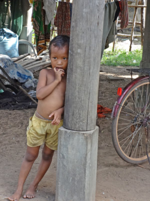 A boy observes our group while we met our sponsored young ladies (high school students)