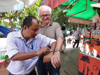 Sareth (left) our local guide just bought a Rolex watch at the Old Market in Siem Reap. He is comparing it to Stan's Rolex.
