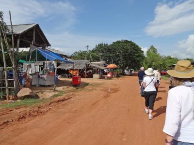 Stacy, Helen, Stan and guide Borin walking in a small village - while traveling to Tonle Sap Lake, Cambodia